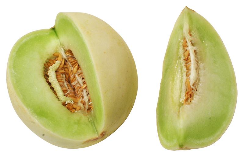 A honeydew melon cut open to show pale green flesh